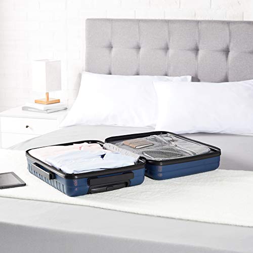 AmazonBasics - Maleta rígida con ruedas, 55 cm, tamaño para cabina, azul marino, apto para la mayoría de las aerolíneas de bajo coste