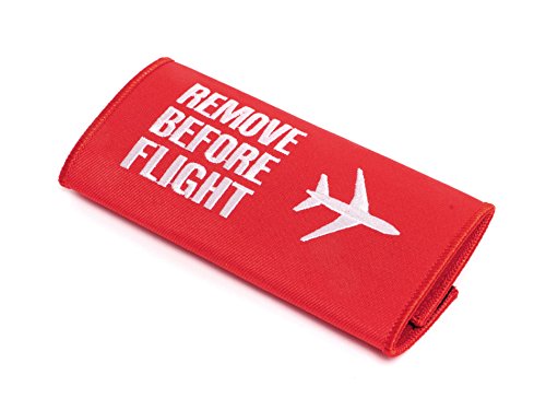 REMOVE BEFORE FLIGHT Empuñadura de Maleta Asa de Equipaje • Travesaño de Transporte • Distribuidor alemán.