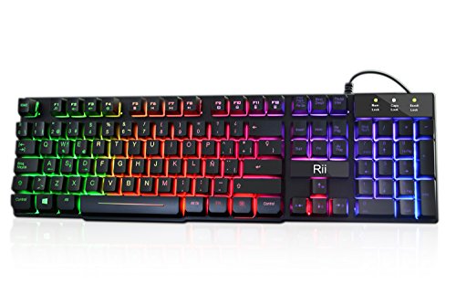 Rii RK100+ Novedoso Teclado USB Retroiluminado,Colores Rainbow y Panel metálico Resistente,Alta sensibilidad Ideal para Jugar, QWERTY con Layout Español Teclado espandido.
