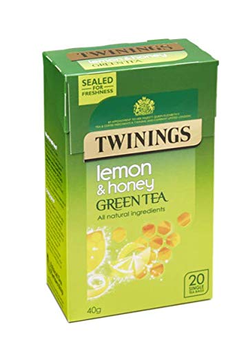 Té verde miel limón infusión con Steens MGO crudo sin pasteurizar Nueva Zelanda Manuka Miel, taza y cuchara.